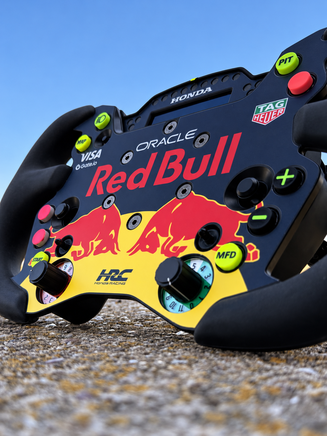 Close-up of a Red Bull-inspired sticker kit fitted to a sim racing wheel